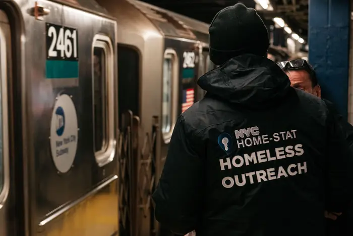 A homelessness outreach worker in the subway system.